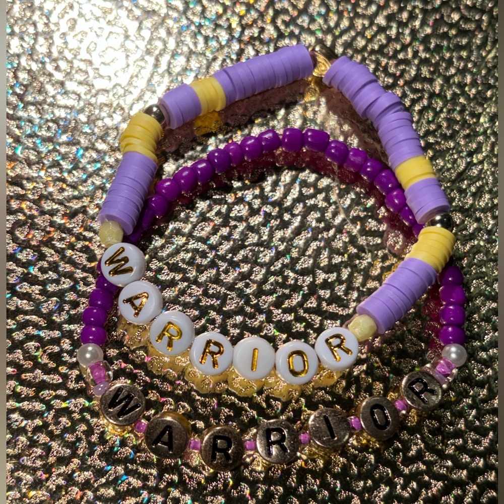 Gold tone bead bracelet “warrior”
